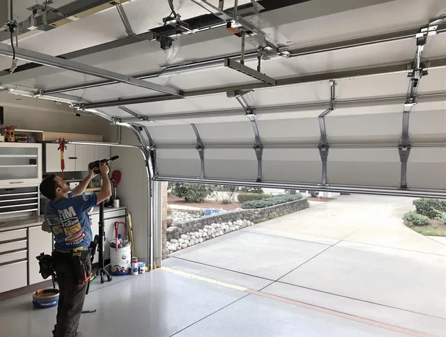 Garage door track repair service by North Port Garage Door Repair in North Port